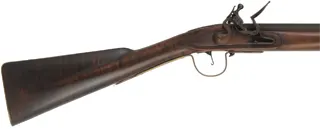 Northwest Trade Gun,
20 gauge smoothbore, 42" octagon-to-round barrel,
L&R lock, maple, brass, used 